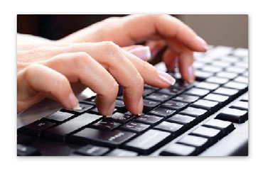 A picture of someone typing on a keyboard